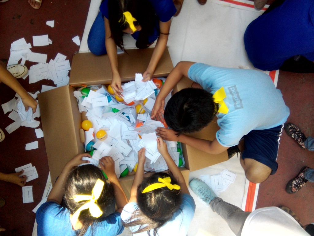 Yellow team rummaging through a box in one of the stations. 