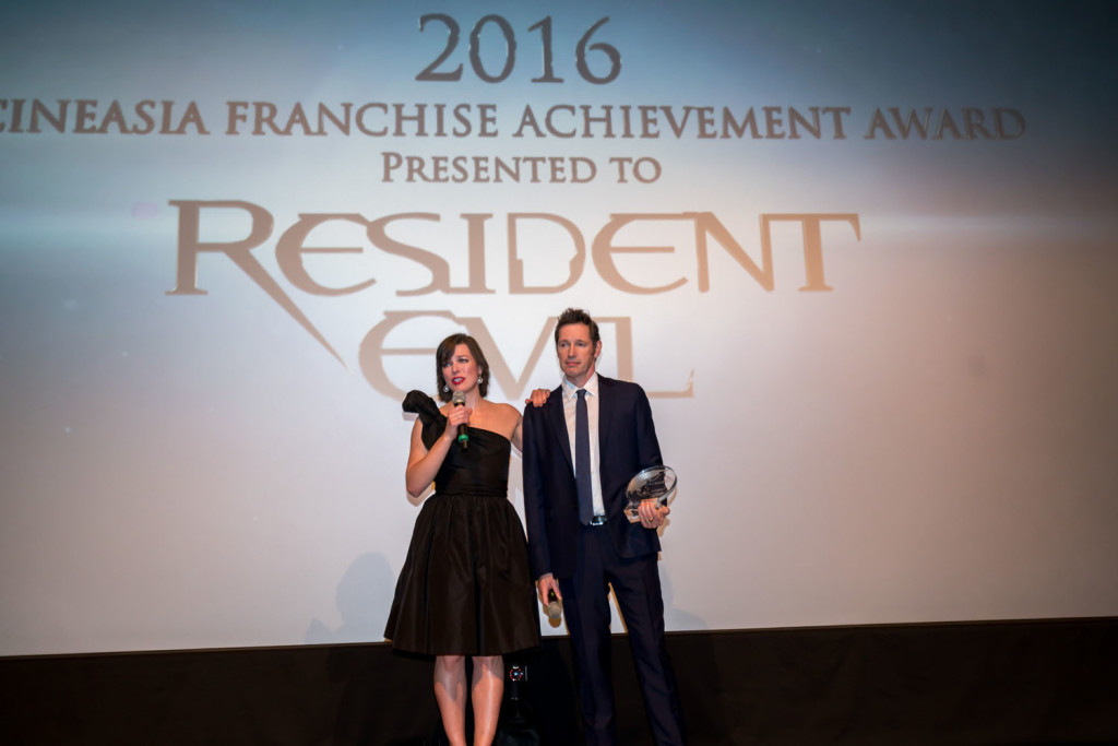 Milla Jovovich and Director Paul W.S. Anderson receive the 2016 CineAsia Franchise Award.