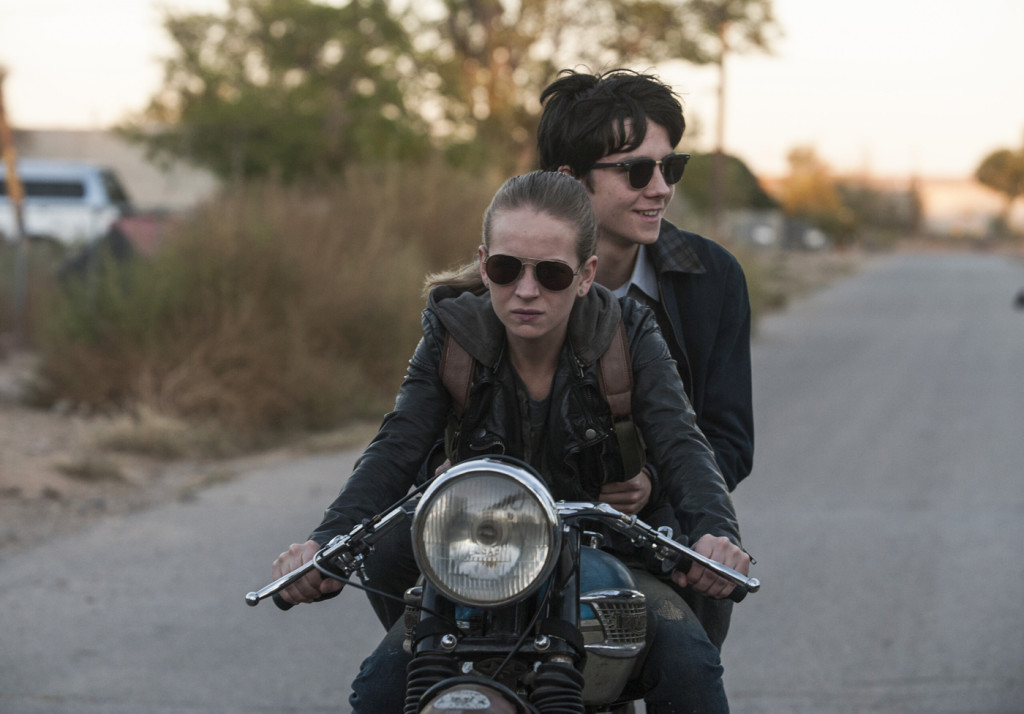 Tulsa (Britt Robertson) rides with Gardner (Asa Butterfield) on her motorcycle