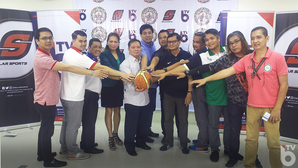 Team coaches and school officials with Mr. Raffy Veloso of Solar Entertainment (center) during the contract signing between NCRUCLAA officials and the network