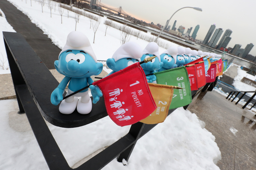 NEW YORK, NY - MARCH 18:  Smurfs hold flags representing the UN's Sustainable Development Goals at the United Nations Headquarters celebrating International Day of Happiness in conjunction with SMURFS: THE LOST VILLAGE on March 18, 2017 in New York City.  (Photo by Cindy Ord/Getty Images for Sony Pictures)