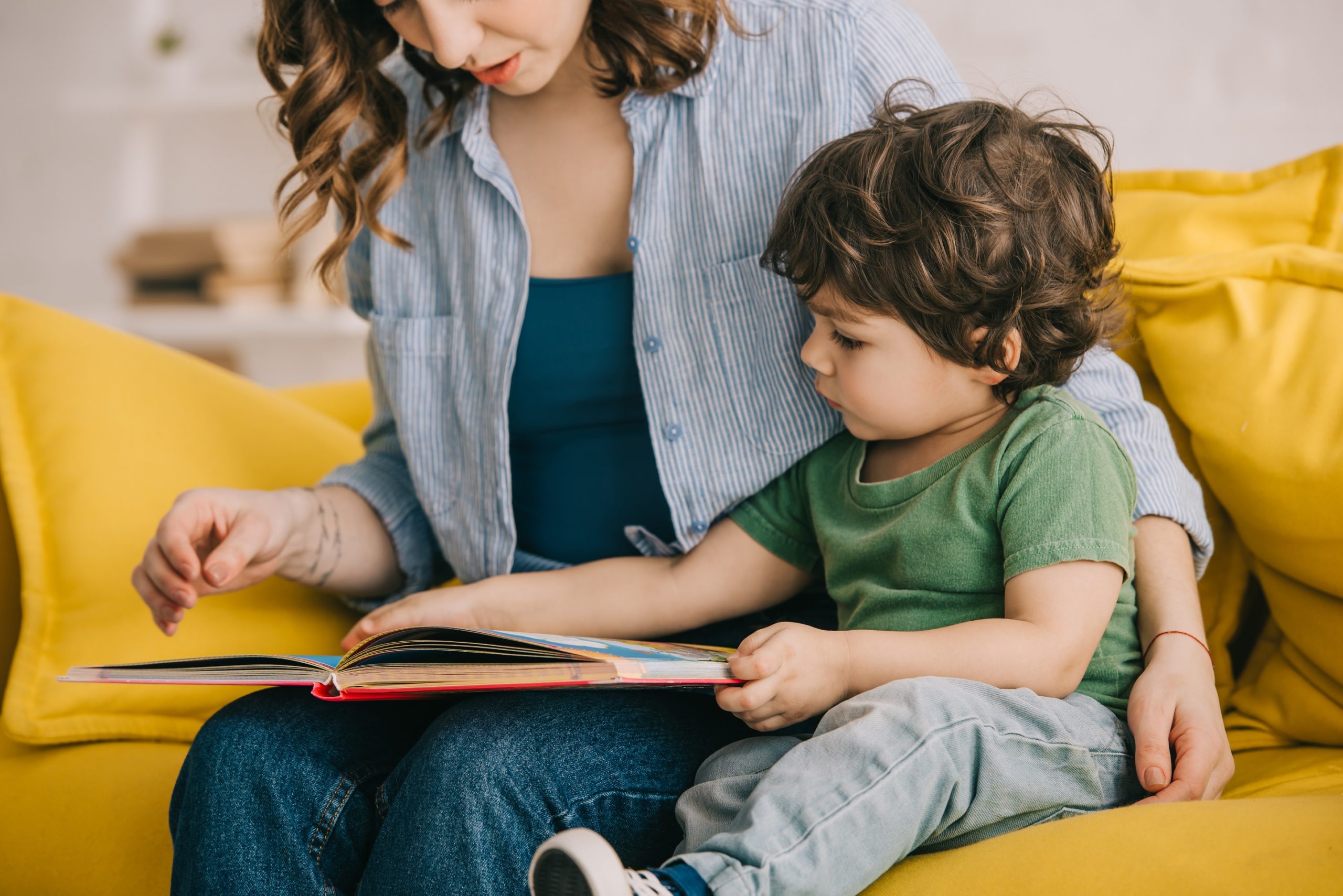 boy reading with mom