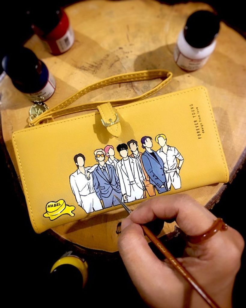yellow wallet with handpainted portrait of BTS