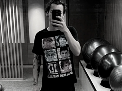 Harry Styles says his viral mirror selfie wearing a 1D shirt was posted by accident