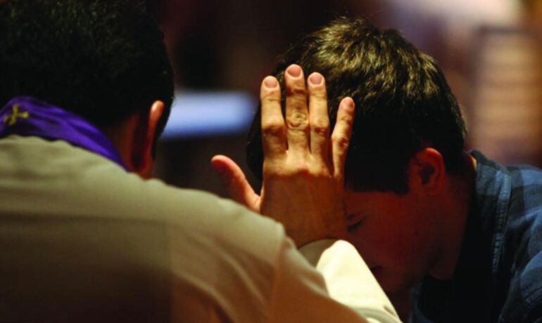 A priest touching a man's forehead pop inqpop
